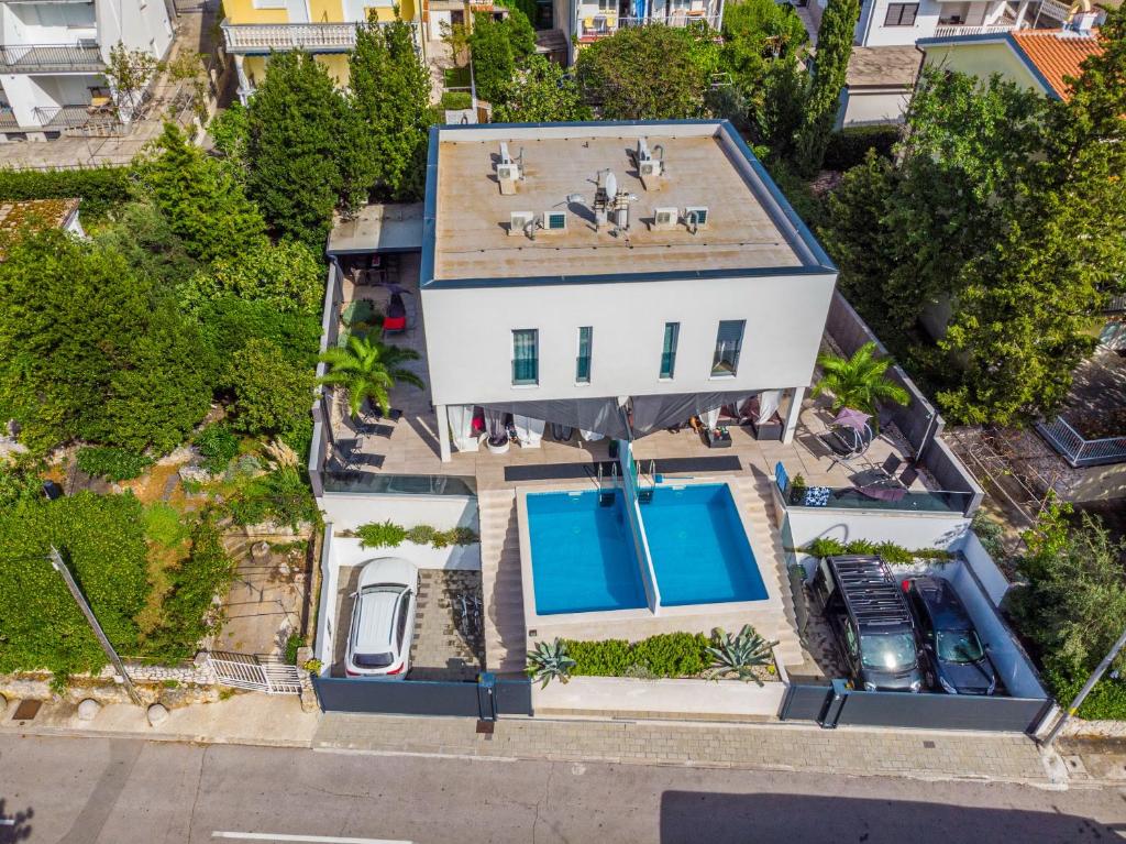 an overhead view of a house with a swimming pool at Villa Luna&Aurora in Selce