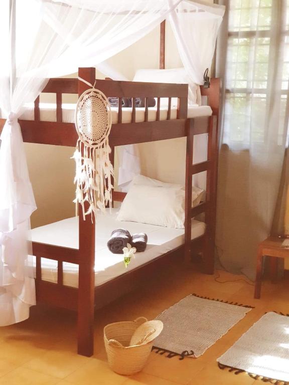 Postel nebo postele na pokoji v ubytování Hakuna Matata Villa
