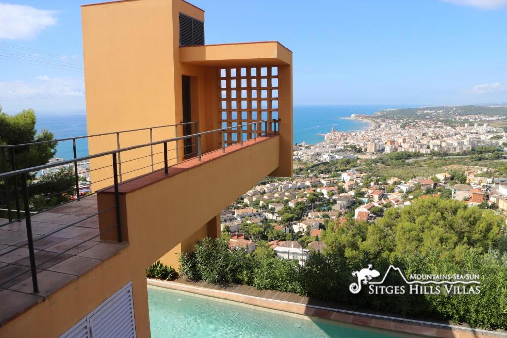 a villa with a swimming pool and a view of the city at VILLA DUMAS WITH AMAZIING SEA VIEWS, A/C AND PRIVATE POOL in Sitges