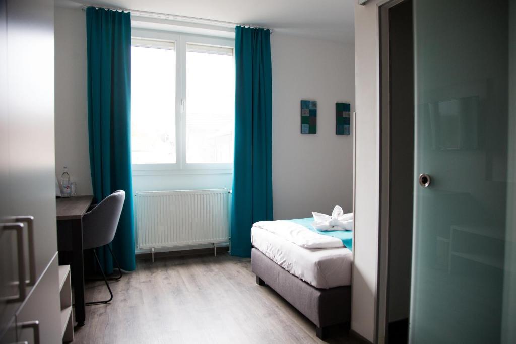 Voodi või voodid majutusasutuse Hotel im Kaiserpark toas