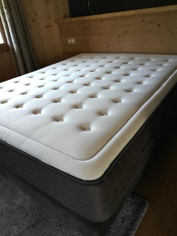 a mattress sitting on a bed in a room at Gîte du Bief de la Chaille in Les Rousses