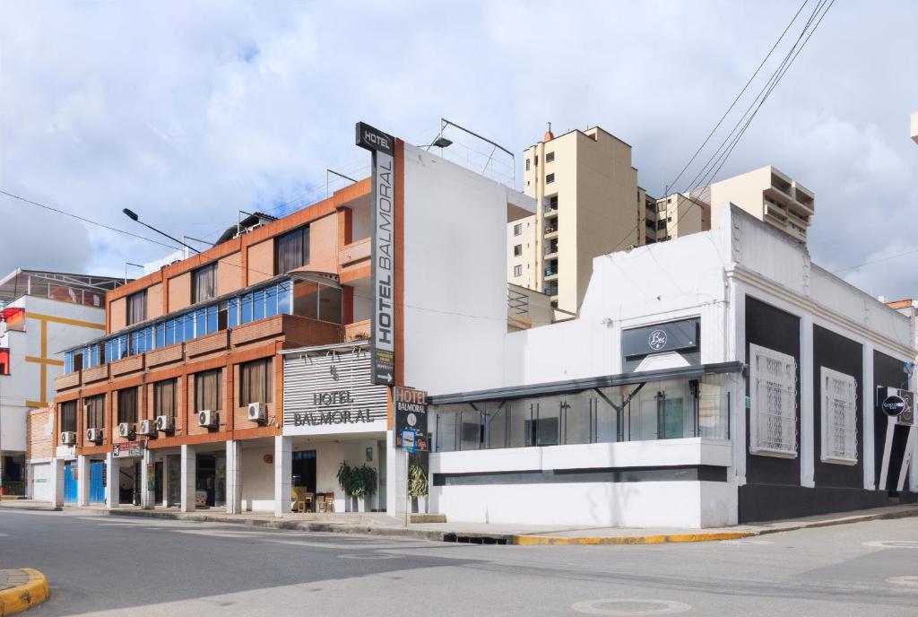 a building on a city street with tall buildings at Hotel Balmoral in Bucaramanga