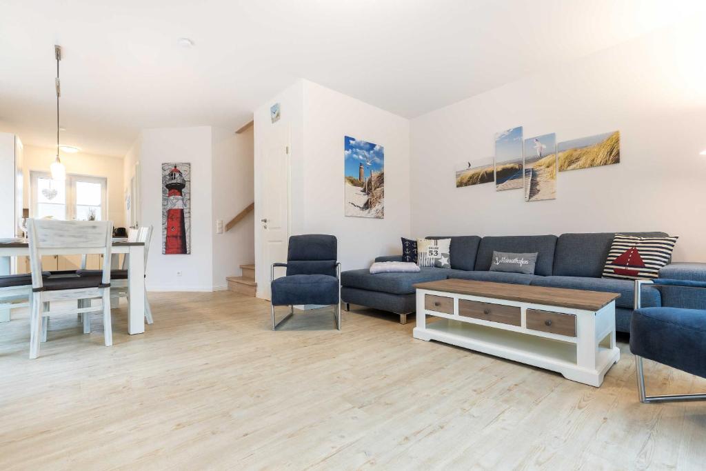 a living room with a couch and a table at Alte Waescherei _9461_ in List