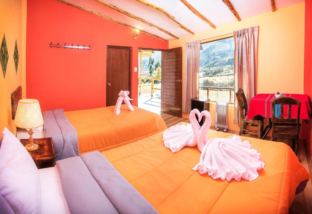 Postel nebo postele na pokoji v ubytování Le Foyer Colca