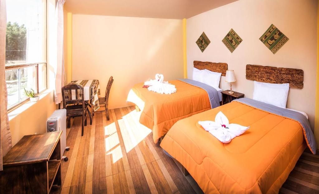Postel nebo postele na pokoji v ubytování Le Foyer Colca