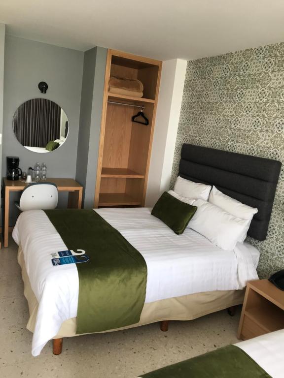 Postel nebo postele na pokoji v ubytování Hotel Ros Gaud