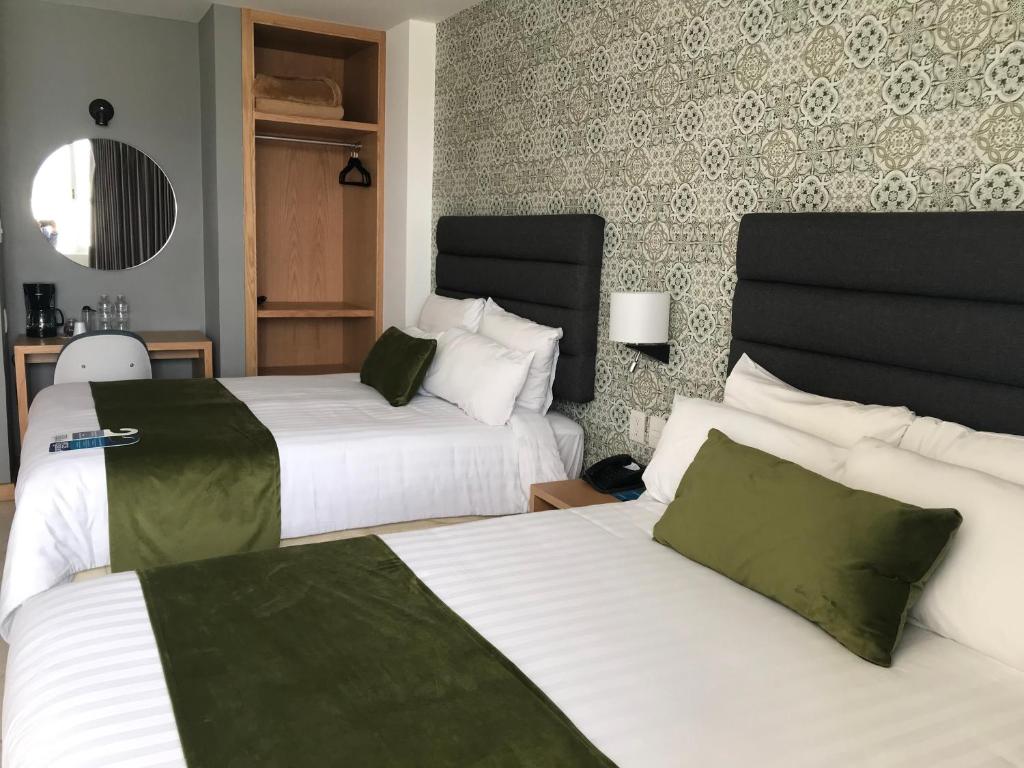 Postel nebo postele na pokoji v ubytování Hotel Ros Gaud