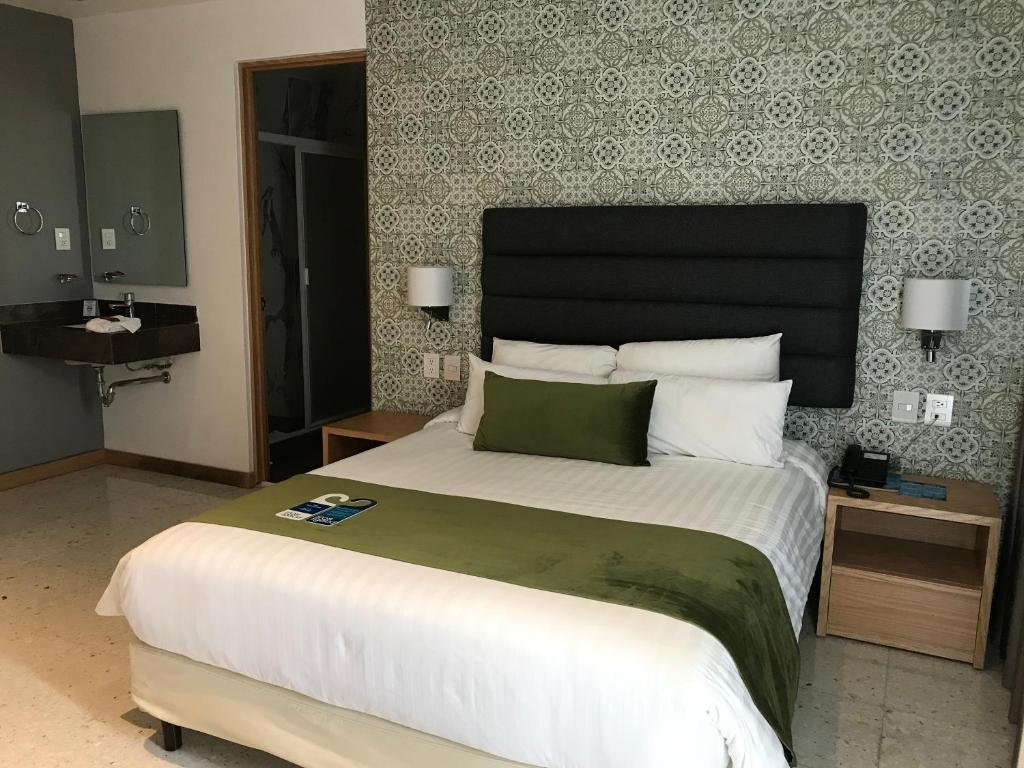 Postel nebo postele na pokoji v ubytování Hotel Ros Gaud