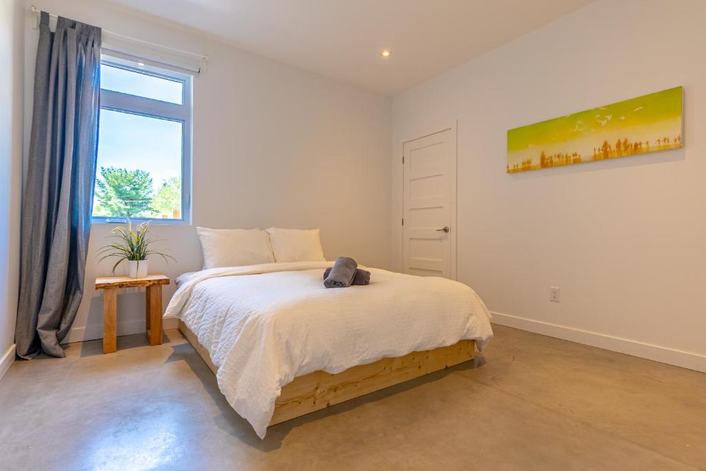 Postel nebo postele na pokoji v ubytování Hôtel-Appartements de la Gare
