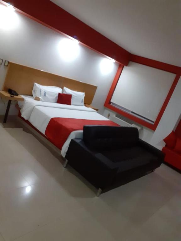 Postel nebo postele na pokoji v ubytování Hotel CEO