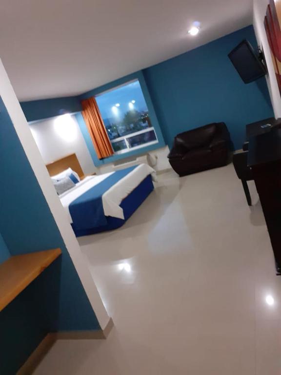 Postel nebo postele na pokoji v ubytování Hotel CEO