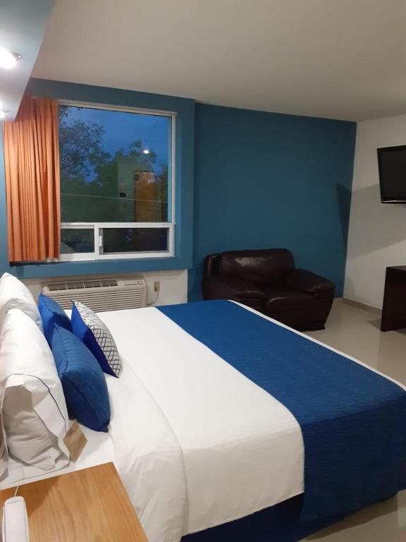Postel nebo postele na pokoji v ubytování Hotel CEO