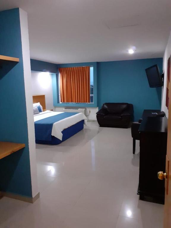 Postel nebo postele na pokoji v ubytování Hotel CEO