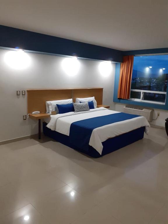 Postel nebo postele na pokoji v ubytování Hotel CEO