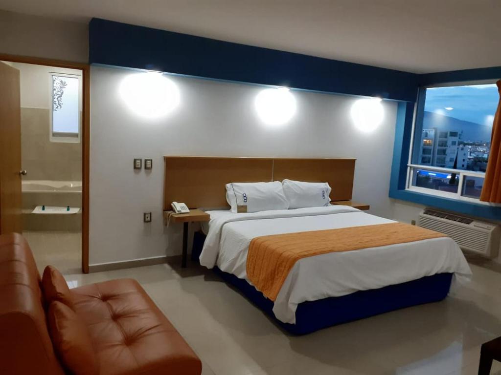 Postel nebo postele na pokoji v ubytování Hotel CEO