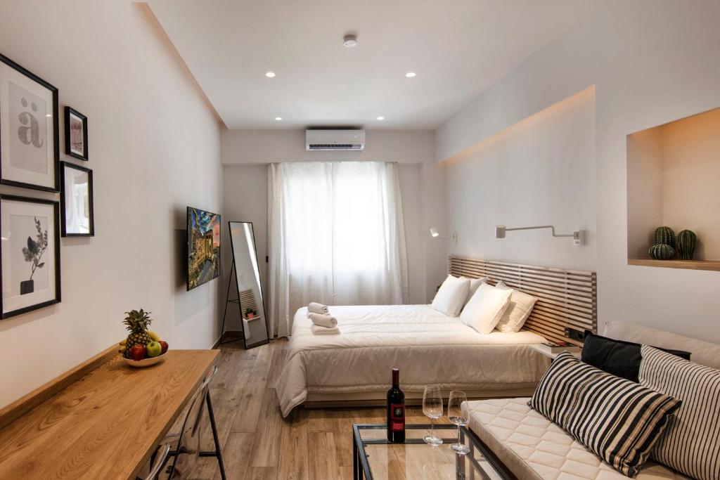 A bed or beds in a room at Downtown Syntagma apartment 2
