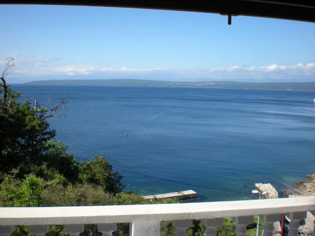 a view of the ocean from a balcony at Apartment Boto - 20m from the sea in Smergo