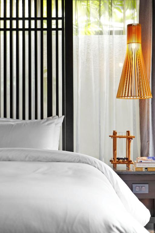 Postel nebo postele na pokoji v ubytování Sareeraya Villas & Suites