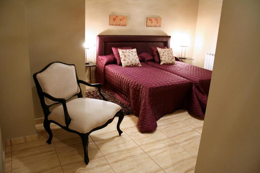 Posteľ alebo postele v izbe v ubytovaní Hostal Mesón Castilla