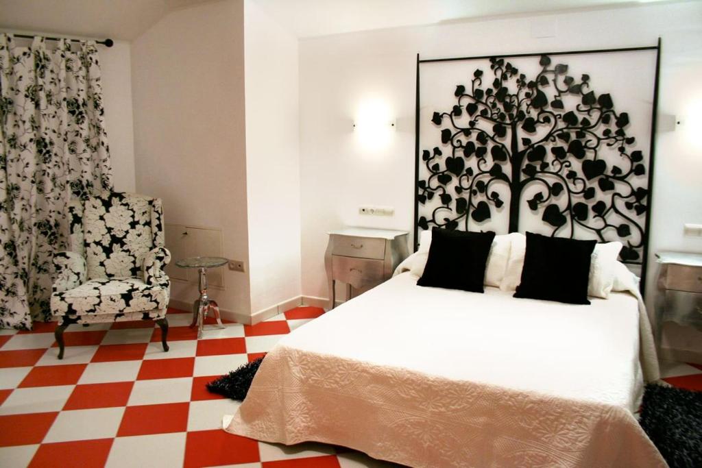 Posteľ alebo postele v izbe v ubytovaní Hostal Mesón Castilla
