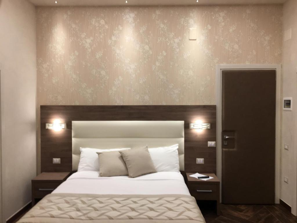 Ein Bett oder Betten in einem Zimmer der Unterkunft Villa Pallotta Luxury B&B