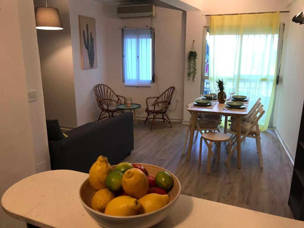 a bowl of fruit on a table in a living room at Cactus Apartment in Torremolinos