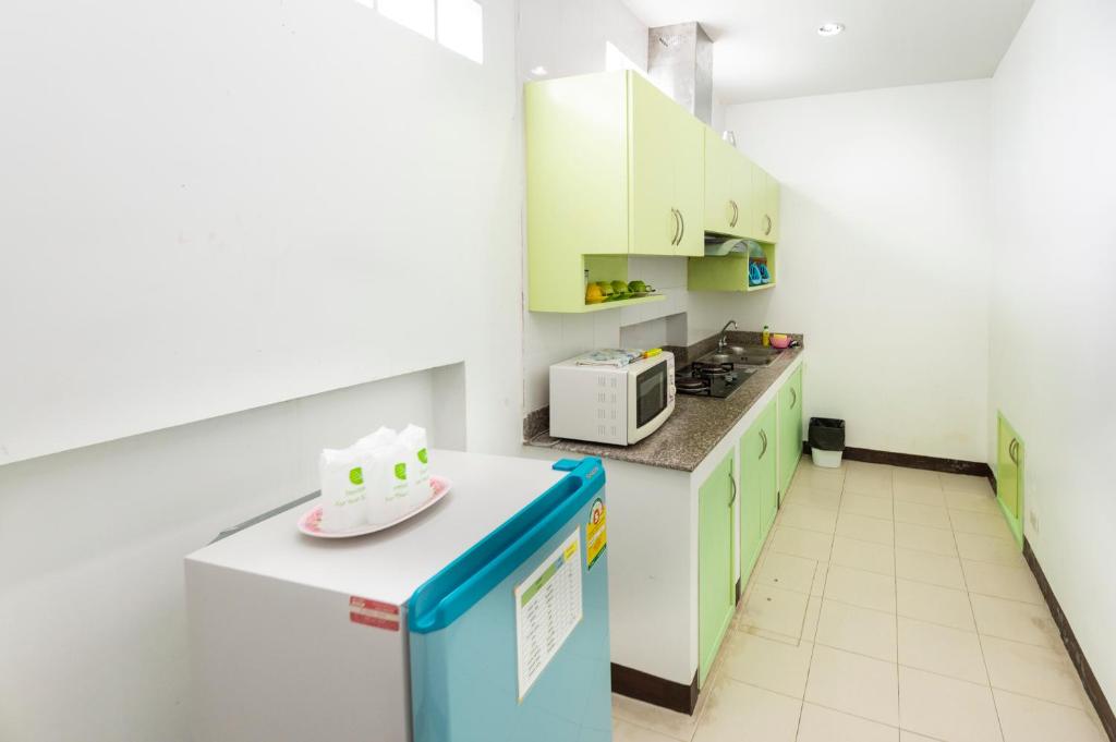 Kuchyň nebo kuchyňský kout v ubytování Baan Noppadol Hua Hin Resort