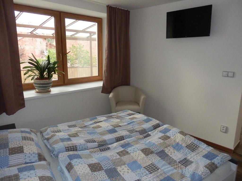 Postel nebo postele na pokoji v ubytování Apartmány 27