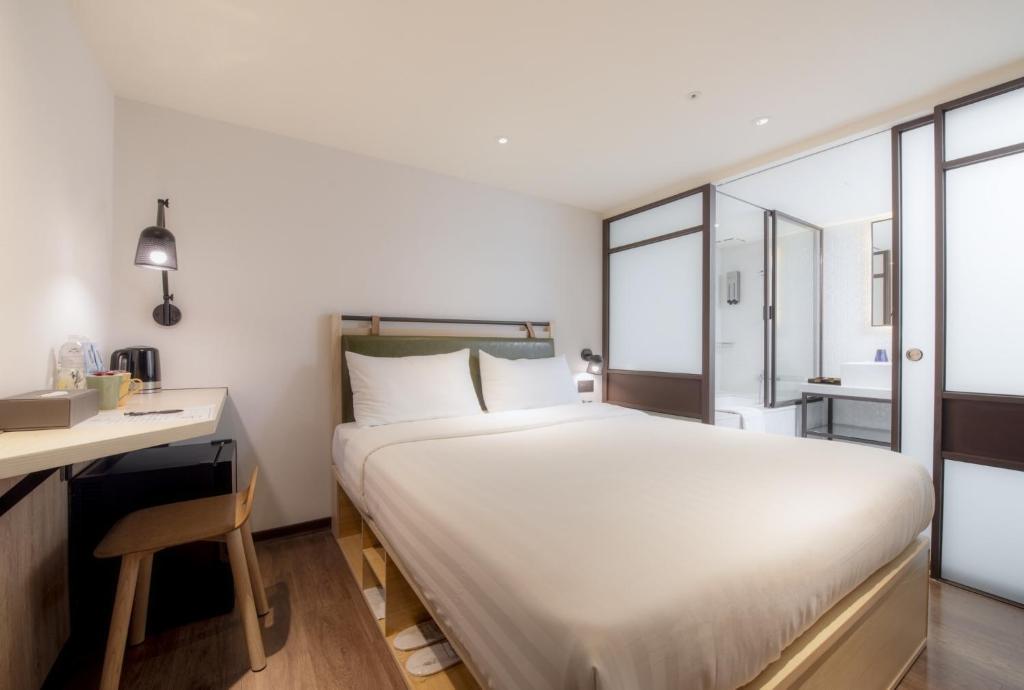 Postel nebo postele na pokoji v ubytování City Suites - Main Station
