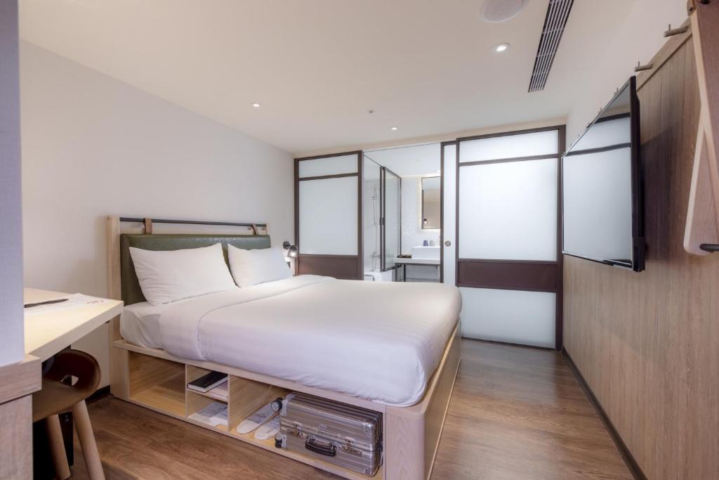 Postel nebo postele na pokoji v ubytování City Suites - Main Station