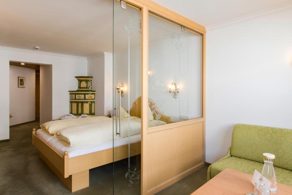 Postel nebo postele na pokoji v ubytování Hotel Anemone