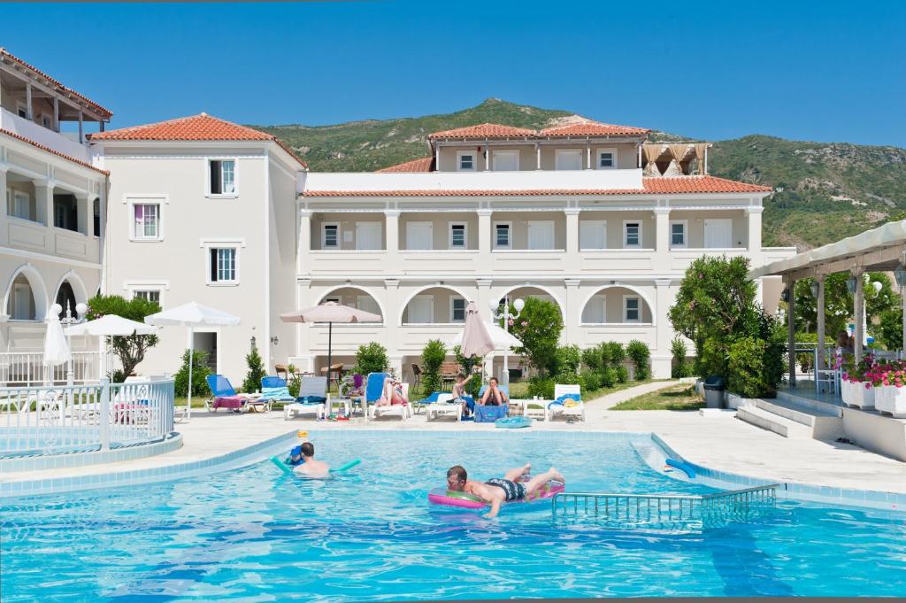 a group of people in the swimming pool at a hotel at Klelia Beach Hotel by Zante Plaza in Kalamaki