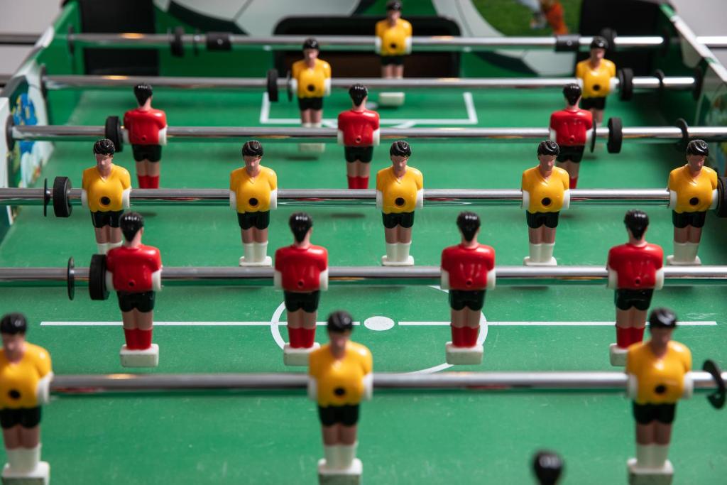 a group of toy figures on a pool table at Grand Hotel in Braşov