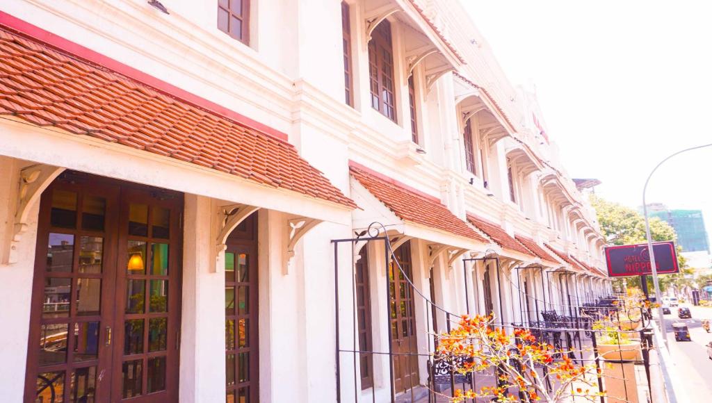 a row of buildings on a city street at Hotel Nippon Colombo in Colombo