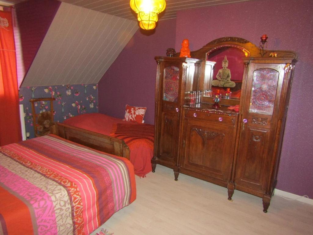 A bed or beds in a room at Fermette dans les pays de la Loire