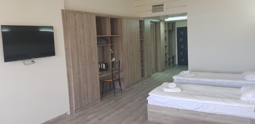 Postel nebo postele na pokoji v ubytování Cross Health Spa Center