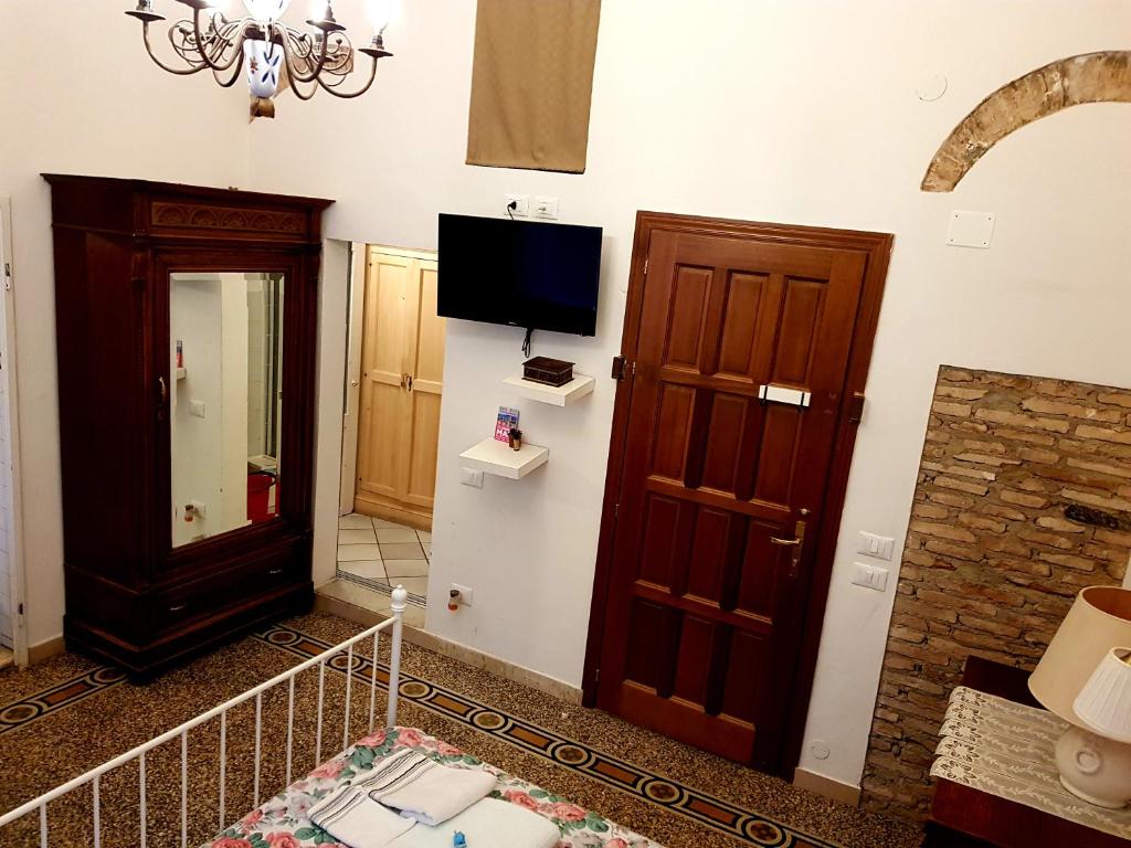 Televízia a/alebo spoločenská miestnosť v ubytovaní Florence Signoria Apartment