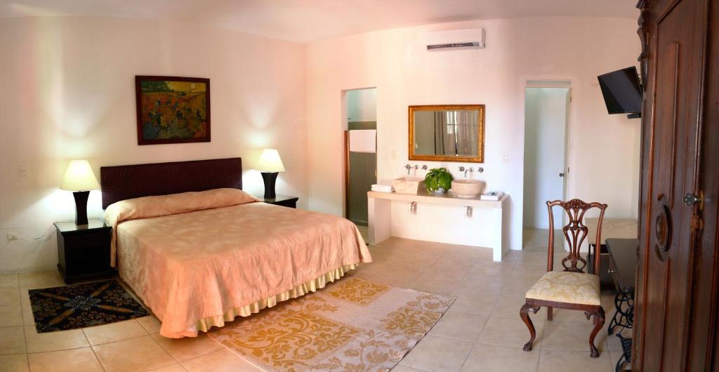 Postel nebo postele na pokoji v ubytování Hotel Mejorada Merida