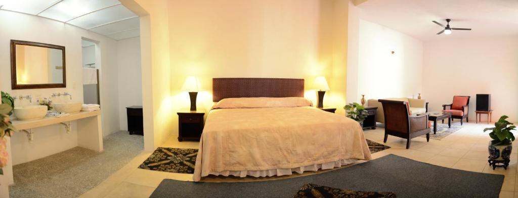 Postel nebo postele na pokoji v ubytování Hotel Mejorada Merida
