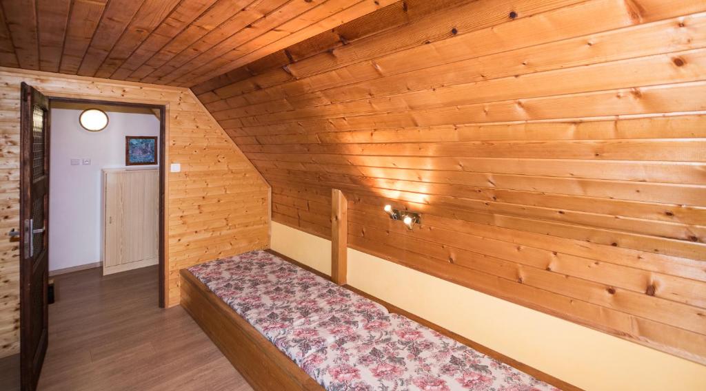 Postel nebo postele na pokoji v ubytování Chata Hansenka