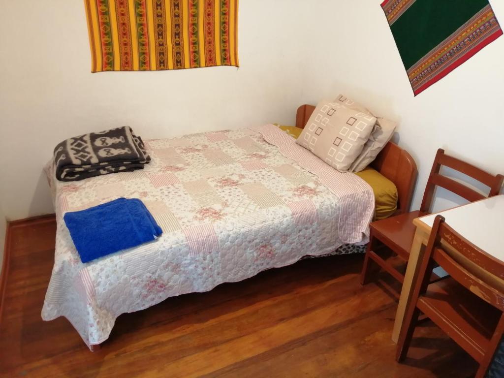 Postel nebo postele na pokoji v ubytování Carlos Guest House 3 Cusco