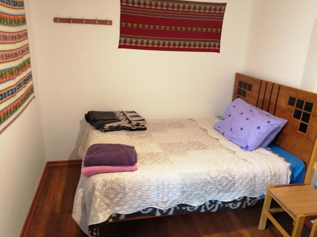 Postel nebo postele na pokoji v ubytování Carlos Guest House 3 Cusco