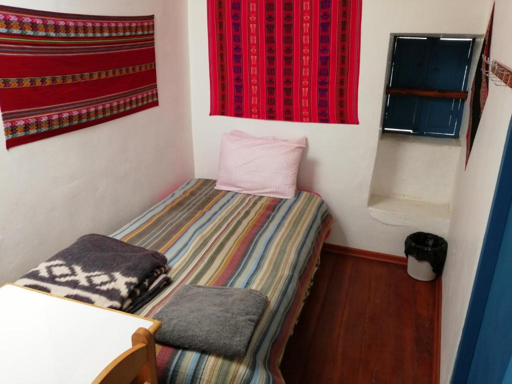 Postel nebo postele na pokoji v ubytování Carlos Guest House 3 Cusco