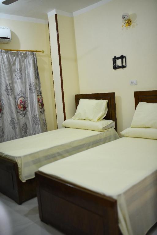 Postel nebo postele na pokoji v ubytování Kosh royal house