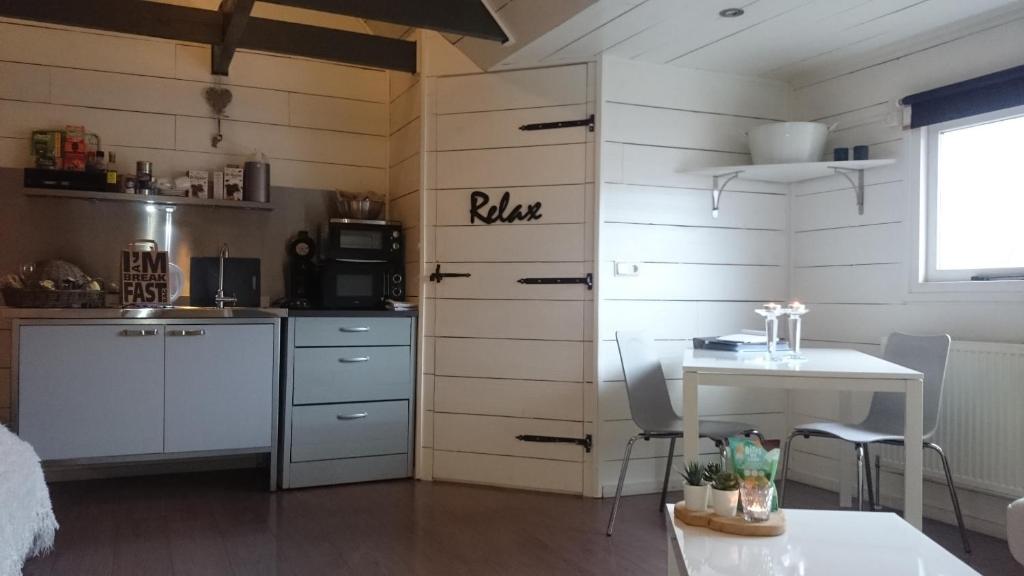 Kuchyň nebo kuchyňský kout v ubytování B&B in de Dorpsstraat