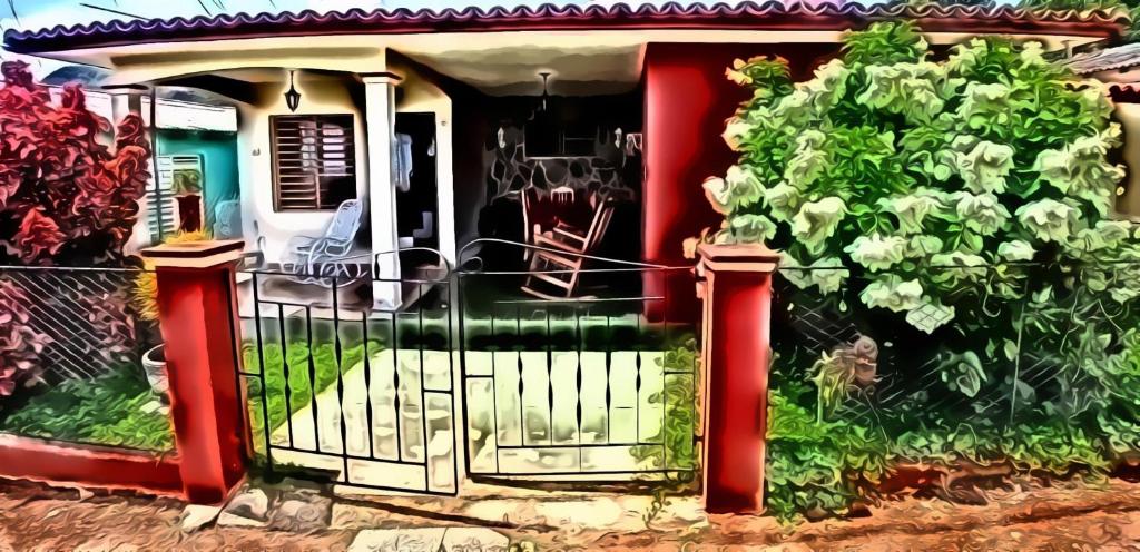 a front door of a house with a gate at Casa Tania Fernandez in Viñales