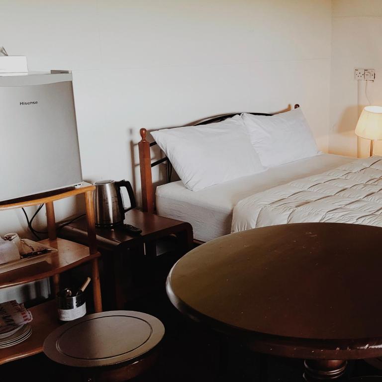Postel nebo postele na pokoji v ubytování Kurau Inn Farmstay