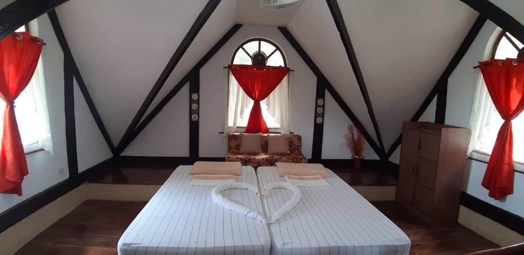 Postel nebo postele na pokoji v ubytování Isla de Paz Beach Resort