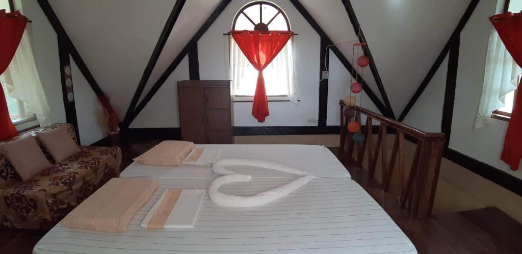 Postel nebo postele na pokoji v ubytování Isla de Paz Beach Resort