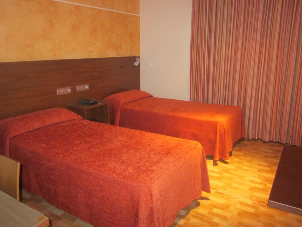 Кровать или кровати в номере Hotel Totana Sur